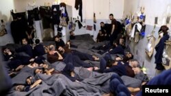  شام سے داعش کے چلے جانے کے بعد ان سے تعلق رکھنے والے غیر ملکی افراد ایک جیل کے سیل میں، فوٹو رائٹرز،7 جنوری 2020