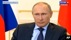 Tổng thống Nga Vladimir Putin trả lời các câu hỏi liên quan tới tình hình Ukraina tại Moscow, ngày 4/3/2014.