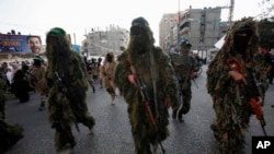Thành viên của lữ đoàn Ezz Al-Din Al Qassam, cánh quân sự của Hamas, tại một cuộc diễn hành (ảnh chụp ngày 14/11/2013).