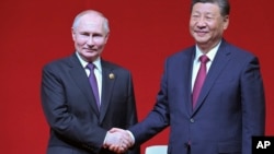 Lãnh đạo Nga và Trung Quốc gặp nhau hôm 16/5.